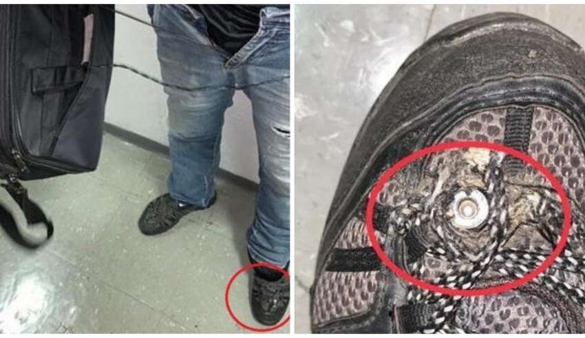 homem câmera tênis metrô