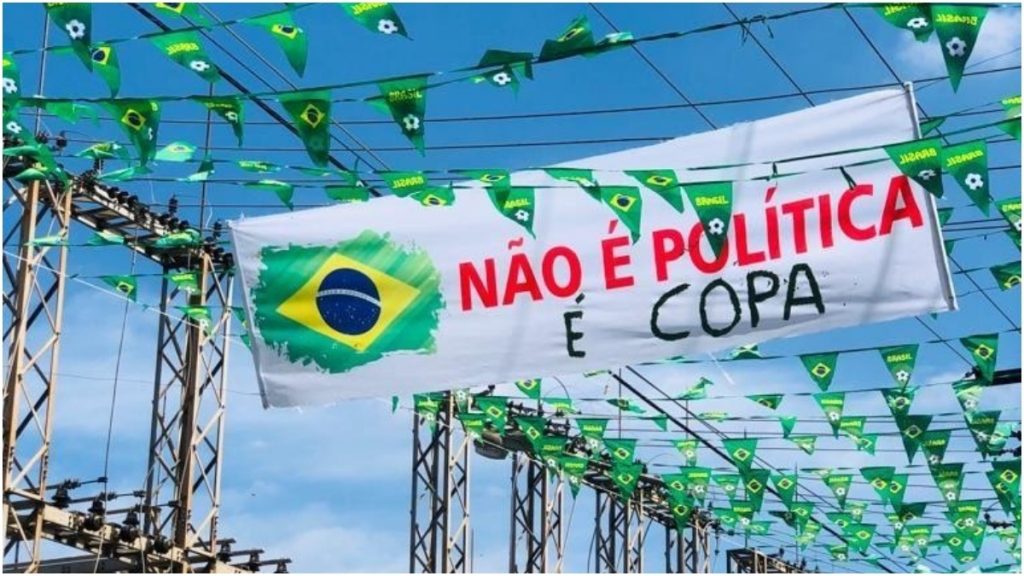 moradores pintam rua para a copa no caiçara