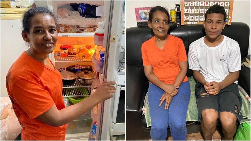 Maria Aparecida mostra a geladeira ao lado do filho Lucas, que escreveu uma cartinha ao Papai Noel pedindo comida pra família